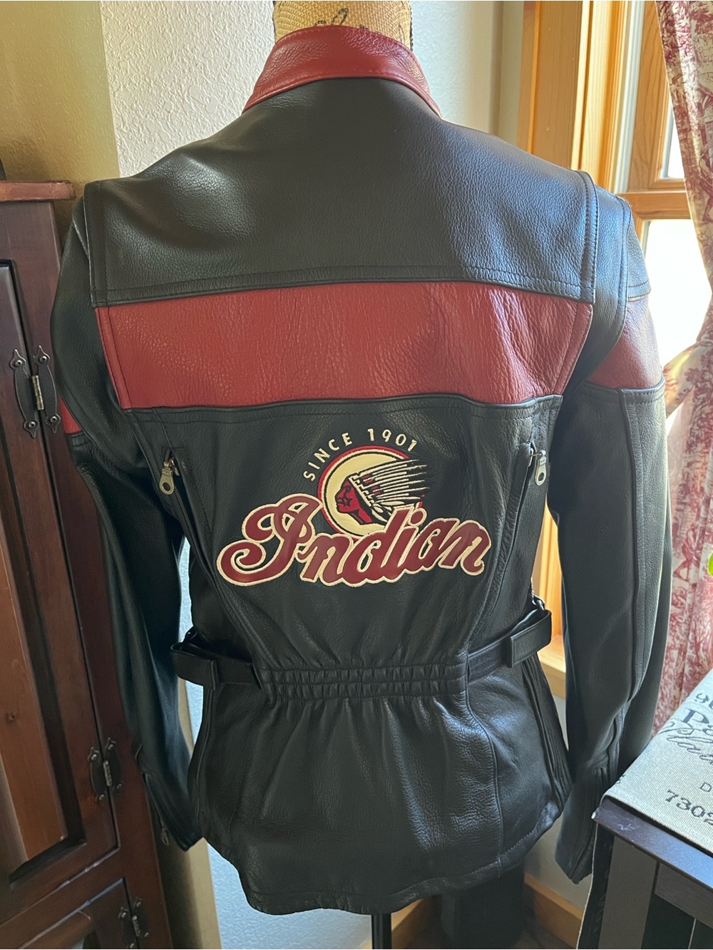 Indian black & red women’s motorcycle leather jacket.  Size medium.